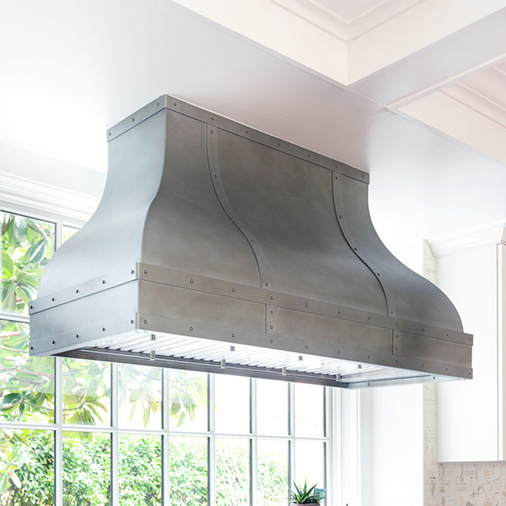 curved zinc vent hood in front of window