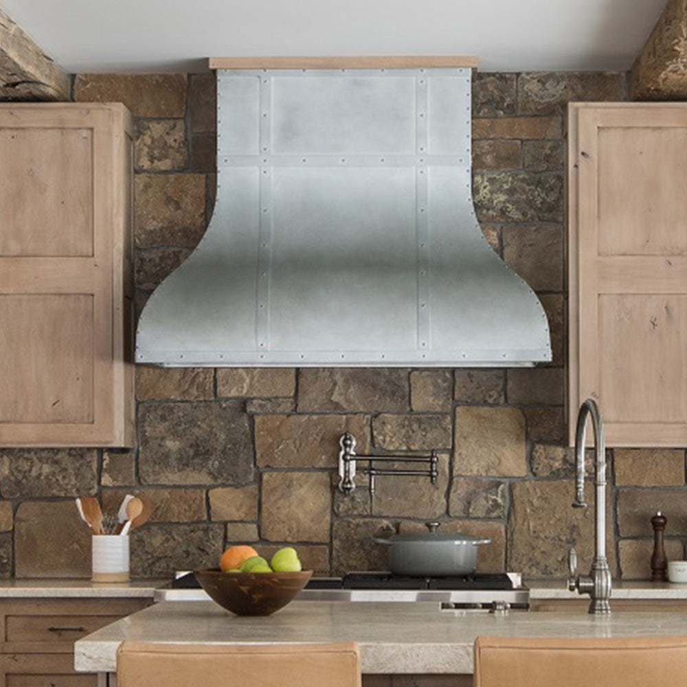 custom zinc range hood in high end mountain modern cabin