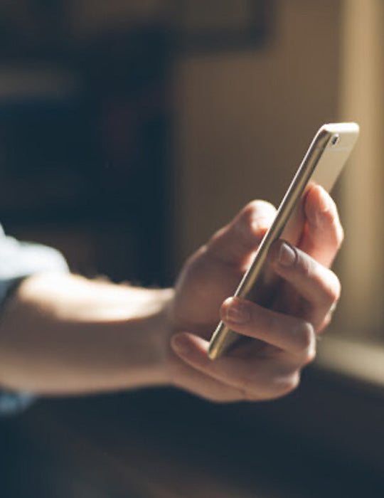 hand holding a phone 