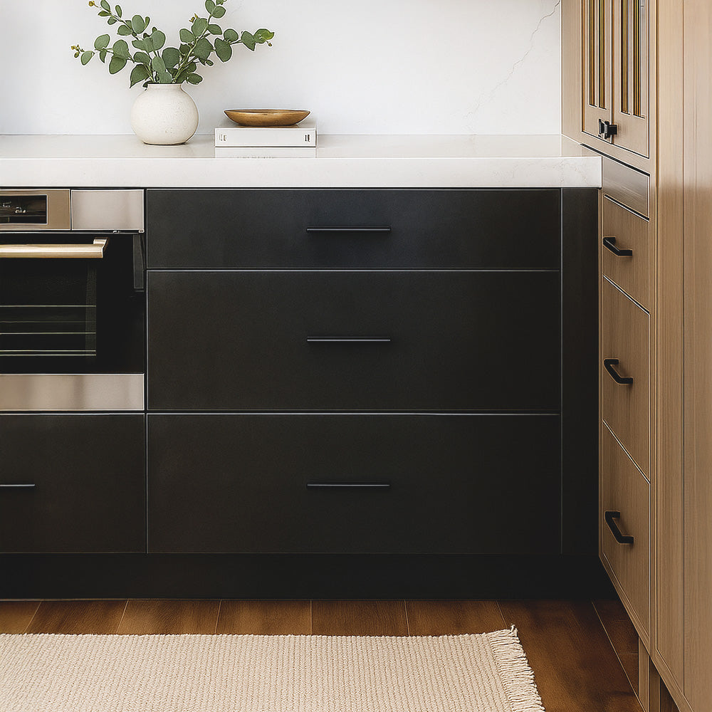 a boho kitchen featuring blackened steel drawer fronts with wood cabinets
