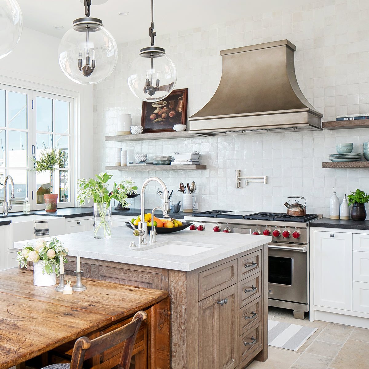 modern rustic kitchen with natural woods and steel range hood over white cabinets