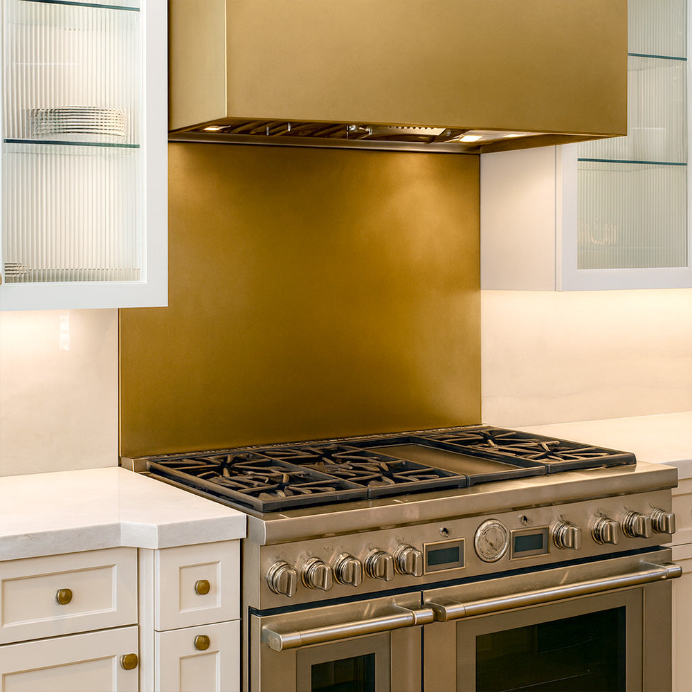 modern kitchen featuring brass backsplash and range hood installation