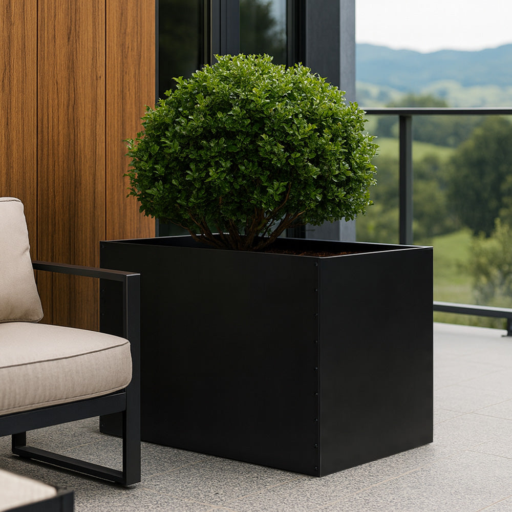 Modern metal planter box designed for outdoor plants and landscaping.