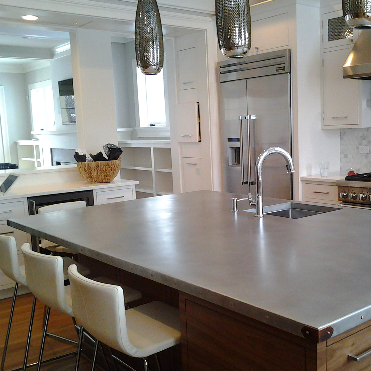 modern white kitchen with zinc countertop